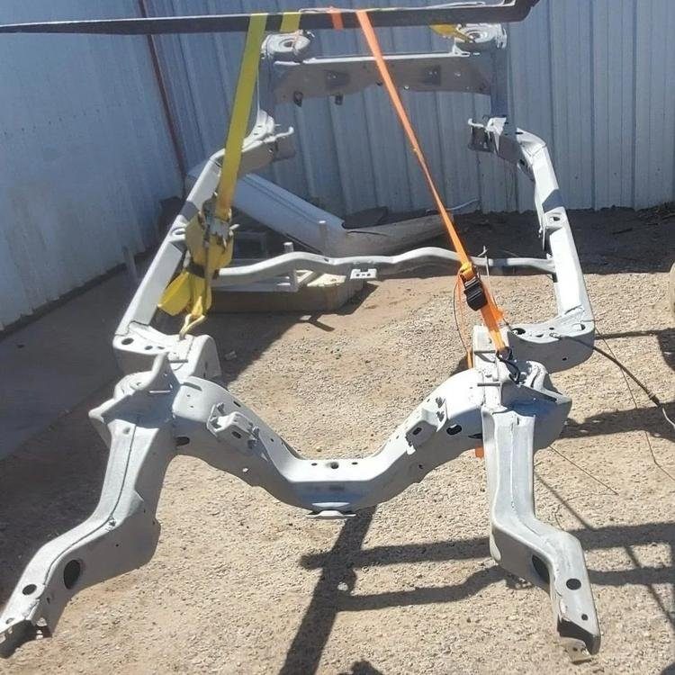 A 1959 Chevelle car frame chassis was media blasted to remove old paint and rust for new prime and paint